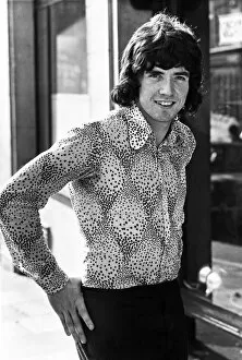 Tottenham Hotspur football player Joe Kinnear poses wearing patterned shirt in the street