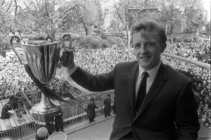 Core93 Gallery: Tottenham Hotspurs Terry Dyson holding the European Cup Winners Cup Winners trophy