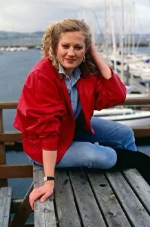 Tracey Childs sitting on wooden table November 1988