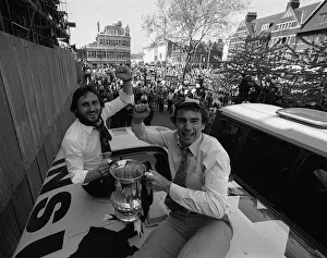 Trevor Brooking and Frank Lampard hold the FA Cup on top of the parade coach on arriving Trevor Brooking and Frank Lampard hold the FA Cup on top of the parade coach on arriving
