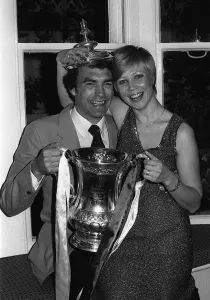 Trevor Brooking with his wife holding the FA Cup at the reception for the West Ham team Trevor Brooking with his wife holding the FA Cup at the reception for the West Ham team