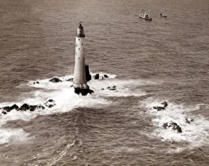 Photography And Film Gallery: A Trinity House steamer waits off the Eddystone Lighthouse to delivery Christmas supplies