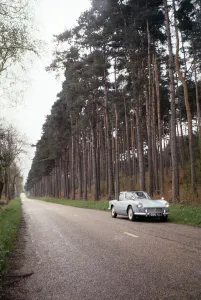 A Triumph Spitfire on a woodland road at Seale in Surrey. April 1964 A Triumph Spitfire on a woodland road at Seale in Surrey. April 1964