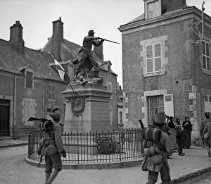 Troops from the 3rd Indian Division moving up to the front admire the statue of a " Troops from the 3rd Indian Division moving up to the front admire the statue of a "