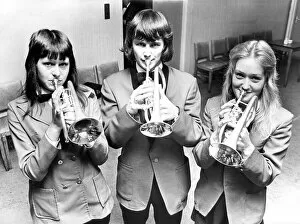 Trying out some new cornets are Barbara Bullock, aged 14, left; Stuart Downie