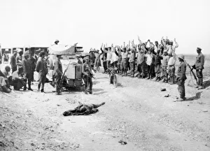 Turkish officers and men seen here surrendering to a British armoured car Turkish officers and men seen here surrendering to a British armoured car