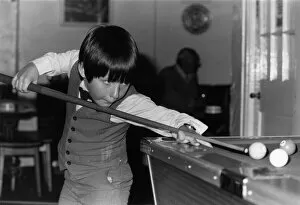 The Tuxedo Kid 8 year old Mark Kiernan seen here at the pool table. 25th September 1984