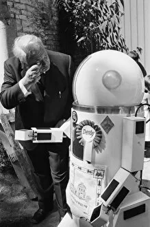 Robotic Gallery: TV Astrologer Patrick Moore meets Denby the robot, which talks, shakes hands and more