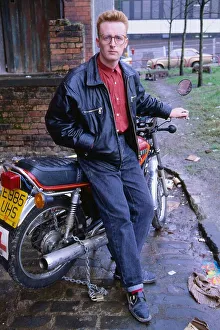 Images Dated 1st July 1990: TV presenter Bryan Burnett sitting on motorcycle 1990