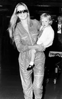 Occupation M Gallery: Twiggy actress and model with 21 month old daughter at Heathrow airport. July 1980