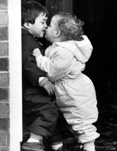 Twins Thomas and Michelle give each other a kiss to celebrate their second birthday Twins Thomas and Michelle give each other a kiss to celebrate their second birthday