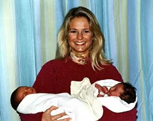 Images Dated 12th January 1994: Ulrika Jonsson TV Presenter holding 2 babies Shaquelle Didson and Eleanor Louise Albury