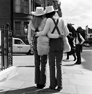 Unisex Wedding. Here come the bride and groom, dressed identically Unisex Wedding. Here come the bride and groom, dressed identically