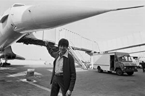 Uri Geller at London Airport standing in front of a Concorde. 1st November 1978