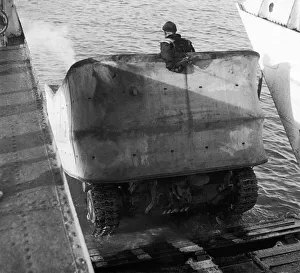 Valentine DD Swimming tanks leave the ramp of a landing craft Valentine DD Swimming tanks leave the ramp of a landing craft