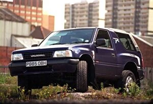 Images Dated 10th June 1997: VAUXHALL FRONTERA SPORTs parked on rough ground dark blue
