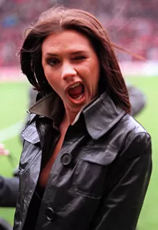 Images Dated 15th March 1997: Victoria Adams member of pop group the Spice Girls suddenly likes football as she visits