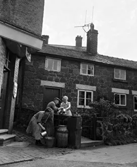 A village without water at Ruyton-XI-Towns, Shropshire. Churns are placed outside each A village without water at Ruyton-XI-Towns, Shropshire. Churns are placed outside each