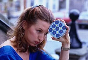 Vivien Heilbron actress August 1988 Holding Rubick clock to head