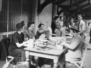 Voluntary workers seen here assembling gas mask boxes at the Broad Street offices of Voluntary workers seen here assembling gas mask boxes at the Broad Street offices of