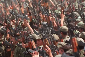 Volunteer Reserve Army in Iraq May 1998 crowds of soldiers with guns raised Volunteer Reserve Army in Iraq May 1998 crowds of soldiers with guns raised