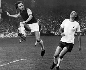 Images Dated 8th September 1973: W. Ham v Spurs. Lampard puts over a centre leaving Gilzean gasping