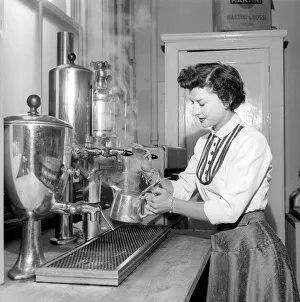 00068 Gallery: Waitress / woman seen here preparing pots of tea in a cafe. 1957 A17b-002