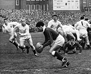 Wales outside half David Watkins clears the ball on the Welsh line during the match Wales outside half David Watkins clears the ball on the Welsh line during the match