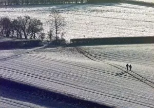 Images Dated 19th December 1999: Walkers brave sub zero temperatures for a stroll across the snow