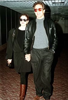Images Dated 27th February 1992: Warren Beatty actor with wife Annette Bening actress arrive at Heathrow airport