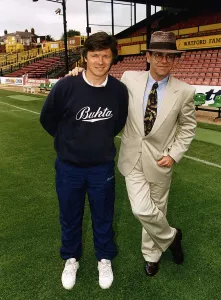 Watford Manager Steve Perryman with Elton John. 5th August 1991 Watford Manager Steve Perryman with Elton John. 5th August 1991