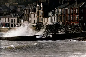 Waves crash against a wall at Millport in Scotland after heavy winds caused the sea to Waves crash against a wall at Millport in Scotland after heavy winds caused the sea to