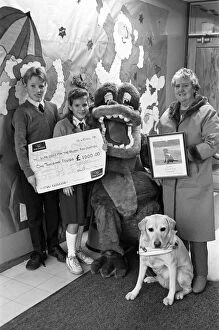 Wellhouse Middle School, Mirfield present a cheque to Guide Dogs for the Blind