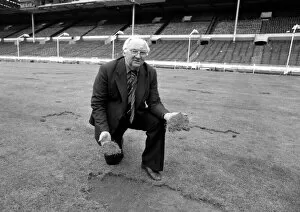 Images Dated 5th June 1977: Wembley groundsman Don Gallacher inspects the damage cause by the Scottish fans following