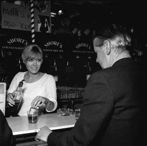 00150 Gallery: Wendy Richard Actress Model aged 19 years old May 1966 serving behind a bar near