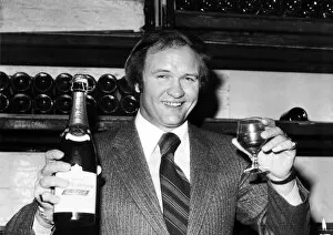 Award Ceremonies Gallery: West Bromwich Albion football manager Ron Atkinson holds up a bottle of champagne at