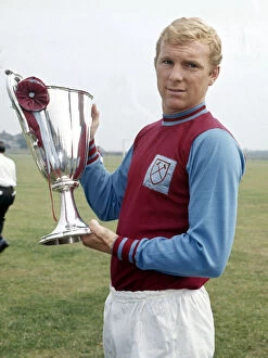 Achievement Gallery: West Ham United captain Bobby Moore holds the European Cup Winners Cup trophy