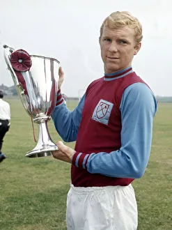 Achievement Gallery: West Ham United captain Bobby Moore holds the European Cup Winners Cup trophy