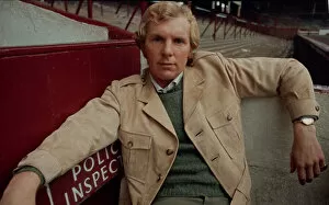 Images Dated 7th February 1970: West Ham United footballer Bobby Moore modelling a belted raincoat at Upton park
