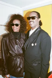 Whitney Houston and Stevie Wonder smile for a photograph backstage at the Nelson Mandela Whitney Houston and Stevie Wonder smile for a photograph backstage at the Nelson Mandela