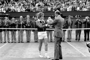 Wimbledon Tennis: Men's Finals 1981: John McEnroe is presented with the trophy Wimbledon Tennis: Men's Finals 1981: John McEnroe is presented with the trophy