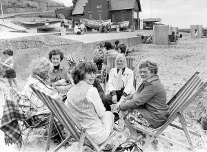 It was so windy at Whitley Bay in August, 1977, that these holidaymakers had to keep It was so windy at Whitley Bay in August, 1977, that these holidaymakers had to keep