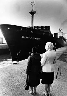 Images Dated 1st April 1982: Two wives watch as the The Atlantic Conveyor, a British merchant navy ship