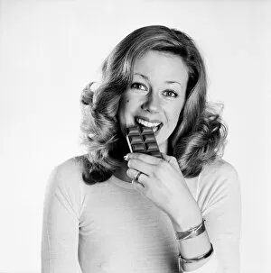 Woman eating chocolate. February 1975 75-00891-002
