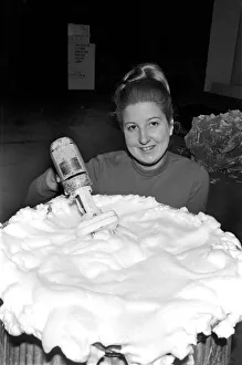 Woman hand mixes the solution to make cream pies to be thrown Woman hand mixes the solution to make cream pies to be thrown