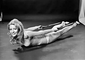 Images Dated 2nd January 1971: Woman lying on the floor doing slimming exercises. January 1971