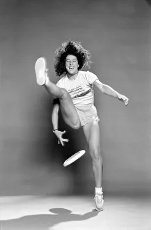 A woman performing exercises with a frisbee. June 1980 A woman performing exercises with a frisbee. June 1980
