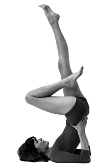Woman stretching as she performs slimming exercises Circa 1975 P007921 Woman stretching as she performs slimming exercises Circa 1975 P007921