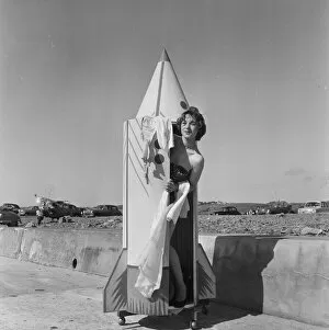 Images Dated 7th October 2010: A woman tries out a new bathing machine at the Water Spalsh beach at St