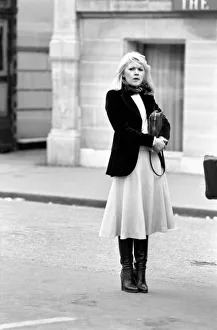 Woman walking through the streets of Paris, France. April 1975 75-2099-011 Woman walking through the streets of Paris, France. April 1975 75-2099-011